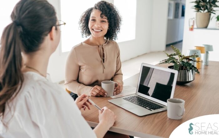 A woman interviews for a job position representing one of the steps during which a caregiver should be evaluating if an agency is a good fit.