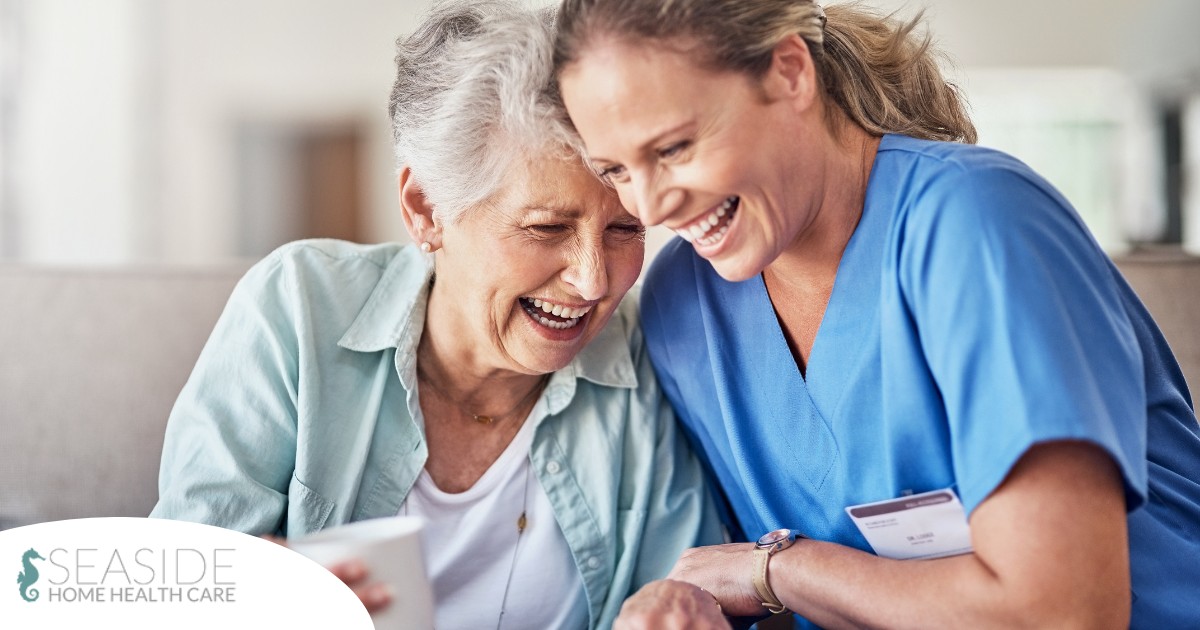 A woman in scrubs laughs with a senior woman, representing how caregiving can be a great career choice.